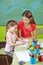 Girl learning to write in preschool