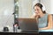 Girl learning watching online course on laptop