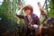 Girl in a leather jacket, a big red fox fur hat in the forest in autumn. A female model poses as a fabulous royal