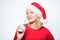 Girl with lemonade and money. Fresh lemonade drink with straw. Symbol of wealth and richness. Girl santa hat drink juice