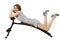 Girl lies on the training apparatus