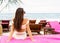 Girl lies on a tropical beach on pink sun loungers