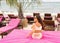 Girl lies on a tropical beach on pink sun loungers