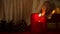 Girl lighting candle on Christmas eve, beautiful holiday decorations, magic