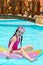 Girl on lilo in pool