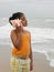 Girl listening to a conch