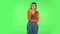 Girl listens to information looking at camera, is shocked and very upset. Green screen