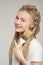 Girl with long dreadlocks holds brush in her hands,  beginning of repair, repair problems on self-isolation, do it yourself repair