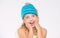 Girl long hair happy face white background. Kid wear warm soft knitted blue hat. Difference between knitting and crochet