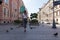 Girl with long hair in jeans and t-shirt walking down the street