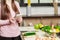 Girl look at the tablet.Young Woman Cooking in the kitchen at home. Healthy Food.