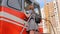 The girl looked through the window of a train locomotive. Lower angle