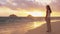 Girl looking at camera at sunrise beach before yoga on Lanikai, Oahu, Hawaii