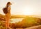 Girl looking at Capo Ferro on Costa Smeralda Sardinia Italy