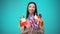 Girl looking at flags in her hands, international student exchange program