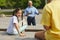 Girl Looking at Friends during Outdoor Lesson