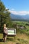 Girl looking at information board and view Straza