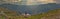 Girl looking at a picturesque view of the  fjord underneath close to Trolltunga