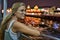 Girl looking at the river leaning on an iron railing at night