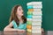 Girl Looking At Stack Of Books
