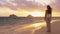 Girl looking at sunrise beach on Lanikai, Oahu, Hawaii