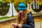 Girl looks pensively into the tablet reads the news from the Internet