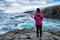 The girl looks at the waterfall Gullfoss in Iceland