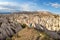 The girl looks at the wonderful landscape of Cappadocia in Turkey, near Goreme. Pink and Red Valley