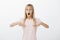 Girl loosing speech from amazement. Portrait of surprised shocked cute daughter with fair hair, pointing at chest with