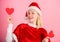 Girl in love happy wear santa costume celebrate christmas pink background. Merry christmas and happy new year. Woman