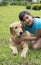 Girl lovingly embraces his pet dog-