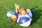 Girl lying among inflating balls