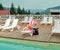 Girl lying on lounger near pool and tanning at daytime.