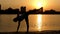 Girl Make Yoga Poses at Sunset on the Beach.