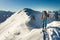 Girl makes ski mountaineering alone toward the mountain pass in a nice track with sealskin