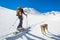 Girl makes ski mountaineering with dog