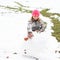 Girl making a big snow ball