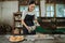 girl making the cake in an apron using cloth chose a hot freshly baked cake pan