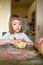 Girl making cookies with mother