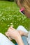 Girl making a daisy chain