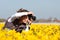 Girl making pictures of flowers