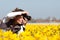 Girl making pictures of flowers