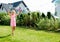 Girl making soap bubbles in home garden