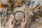 Girl making wreath in oats spikelets. Dried herbs and dried flowers for making herbarium