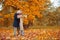 Girl and man or lovers on date hug. Couple in love in park . Autumn dating concept. Man and woman with happy faces