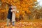 Girl and man or lovers on date hug. Couple in love in park . Autumn dating concept. Man and woman with happy faces