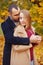 Girl and man or lovers on date hug. Couple in love in park . Autumn dating concept. Man and woman with happy faces