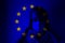 Girl in a mask against the background of the EU flag. Fear of illness, corona virus 2019-2020. Virus, outbreak and mass disease,