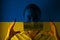 Girl in a mask against the background of the Ukraine flag; danger of disease, new virus