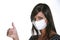 Girl with mask against swine flu.